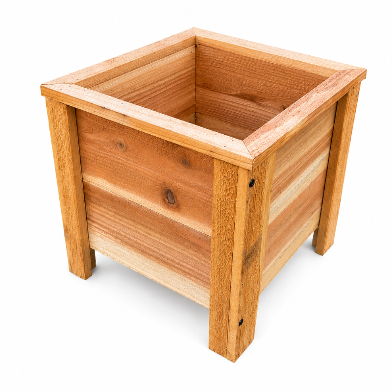 Raised planter filled with fresh vegetables in a well-maintained vegetable garden for optimal growth and harvest.