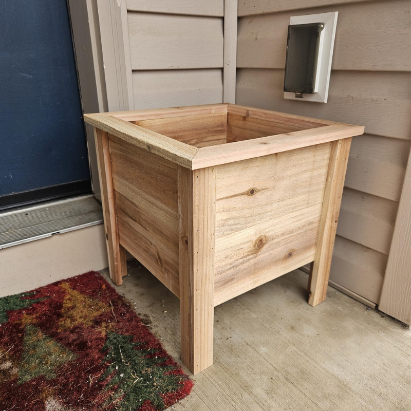 Handmade cedar planter featuring a raised garden design, perfect for outdoor wooden raised garden planters.