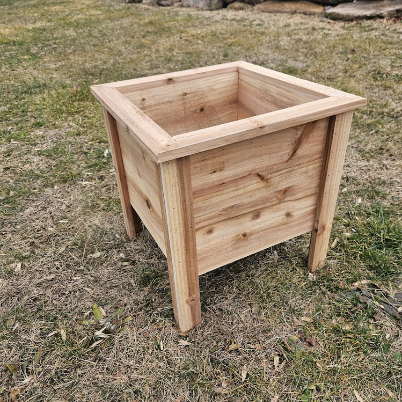 Handmade cedar planter featuring a raised garden design, perfect for outdoor wooden raised garden planters.