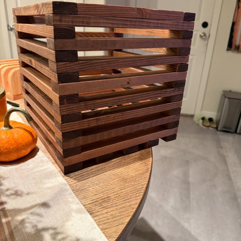 12×12 solid pine planter box with slatted wood construction, showcasing detailed joinery and sanded finish from angled views