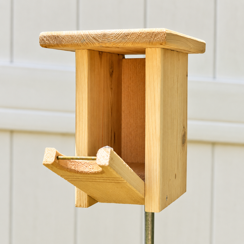 Bluebird nesting box mounted on a tree to provide a safe habitat for bluebirds
